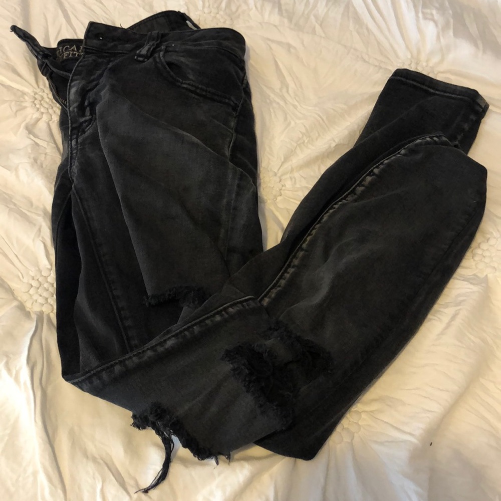 black regular rise skinny jeans with rips